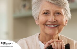 An older woman with healthy teeth smiles, representing good dental hygiene.