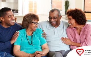 A couple sits with aging parents and enjoys their time together.